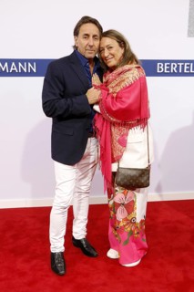 Dieter Landuris and his woman Natascha Landuris arriving at the Bertelsmann Summer Party 2025 at