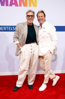Thomas Rath (left) with partner Sandro Rath (right) arriving at the Bertelsmann Summer Party 2025