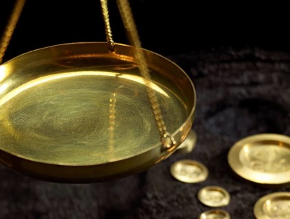 Detail of historic scales with metallic weights in dark back
