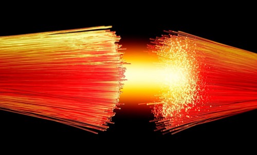 Vibrant illuminated symbolic optical fibers connection closeup in black back