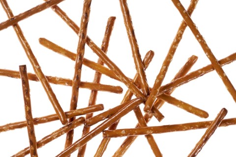 Closeup of some crossed salt sticks in white back