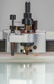 Detail shot of a layout table showing the drawing unit with fixation