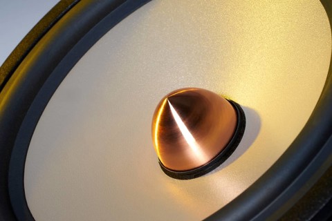 A yellow illuminated loudspeaker detail