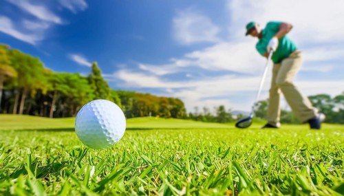 AI generated image showing a golf ball and golf club closeup on a course in sunny ambiance with