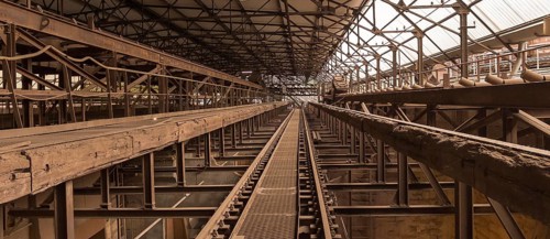 Weathered rusty industrial scenery with old rundown, steel girders and appliances