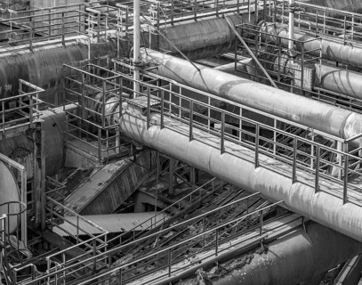 Black and white weathered rusty high angle industrial scenery with old corroded steel girders and