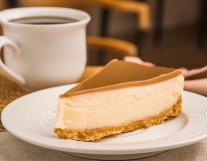 Piece of cake on a plate in coffee-table ambiance, AI generated image