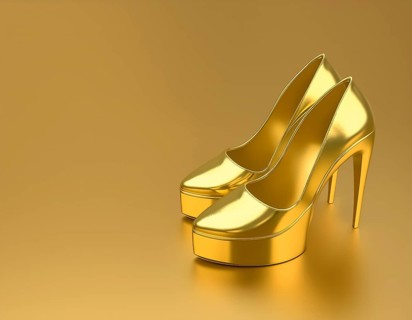 AI generated image showing golden high-heels in golden ambiance