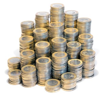Lots of stacked 1 euro coins in white back
