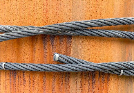 Closeup shot of wire ropes on rusty ground
