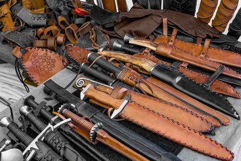 Some daggers and other equipment seen at a medieval market