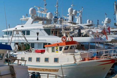 Harbor scenery with some yachts seen in Imperia, a coastal city in Liguria, Italy