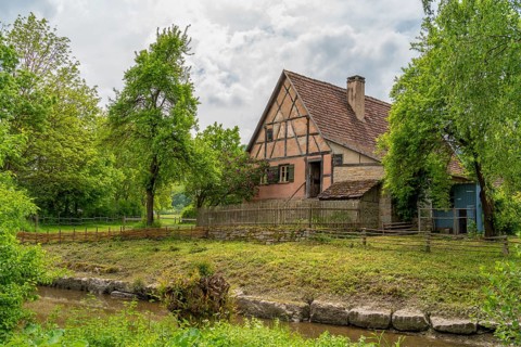 Idyllic scenery with farm house around a rural village in Hohenlohe, an area in Southern Germany at