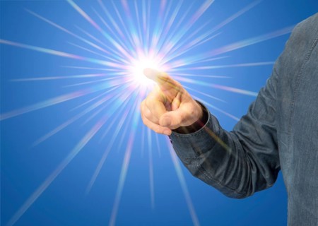 Pointing male hand with starlight in blue back