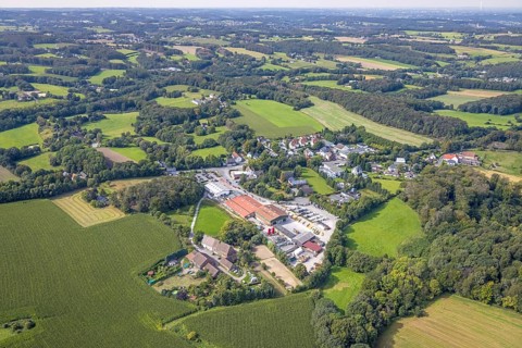 Aerial view, building materials trade Auf dem Böcken am Esborner Weg surrounded by meadows and