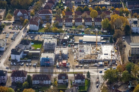 Aerial view, construction site with new building for housing and social services on the former