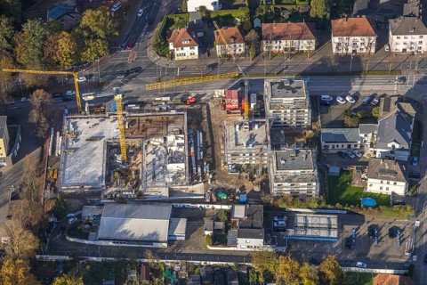 Aerial view, construction site with new building for housing and social services on the former