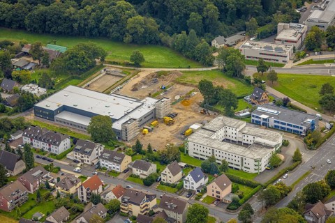 Aerial view, construction site and new construction of a manufactory commissioning area
