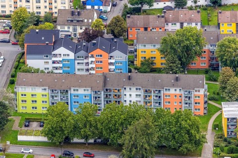 Aerial view, colourful house facades of the GWG housing estate on the street Am Quambusch in the