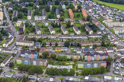 Aerial view, colourful house facades of the GWG housing estate on the street Am Quambusch in the