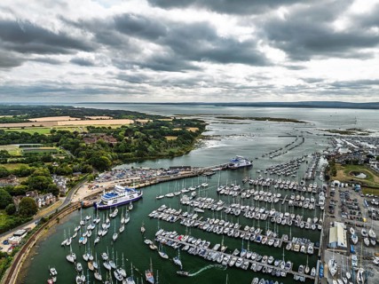 Wight Light car ferry to Isle of Wight on Lymington River and marina from drone, Lymington, New