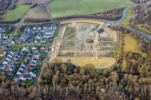 Construction area at Sachsenring with roundabout with housing estate in the district of Heessen in