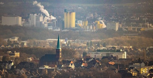 Aerial view of St. Pancratius Church with a view of the harbour and the Jäckering Group mill in