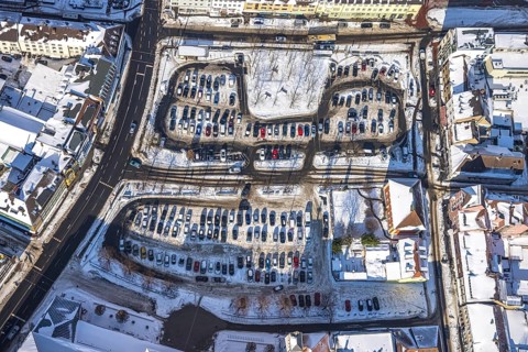 Aerial view, car park Santa-Monica-Platz, location former synagogue, parked cars in the snow,