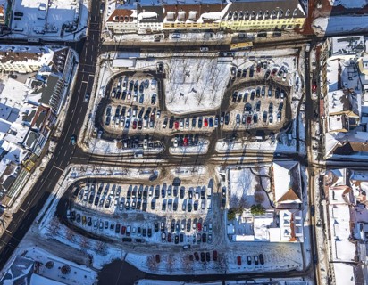 Aerial view, car park Santa-Monica-Platz, location former synagogue, parked cars in the snow,