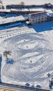 Aerial view, snow-covered field Marker Dorfstraße, winter, vehicle tracks in the snow, Uentrop,