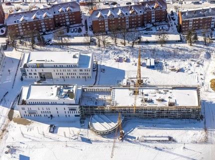 Aerial view, snow, winter, construction area Paracelsuspark with innovation centre, SCI:Q Science