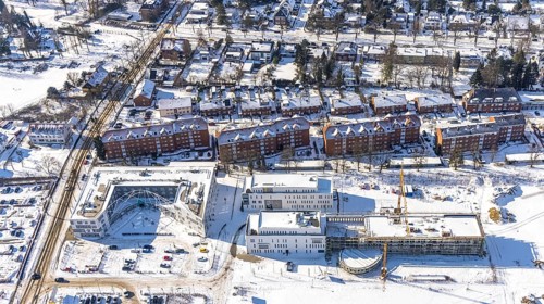 Aerial view, snow, winter, construction area Paracelsuspark with innovation centre, SCI:Q Science