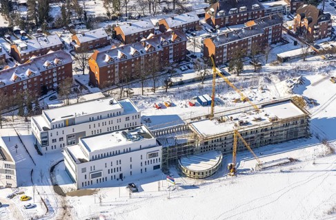 Aerial view, snow, winter, construction area Paracelsuspark with innovation centre, SCI:Q Science