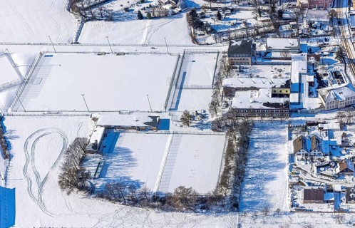 Aerial view, snow-covered sports facility, snow on roofs and streets, VFL Mark, Realschule Mark,