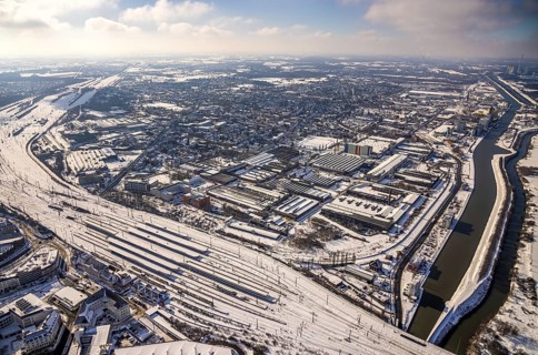Aerial view, Hamm main station, tracks and platforms in the snow, industrial area at the harbour,