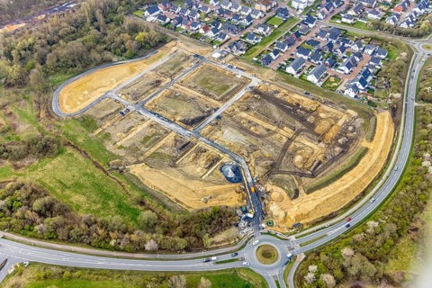 Aerial view, construction site and construction area Heimshof Ost am Sachsenring with housing