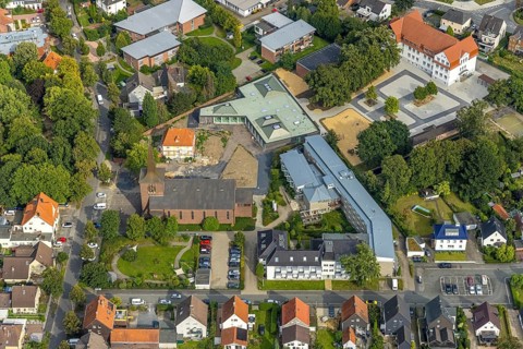 Aerial view, catholic Heilig Kreuz church and Caritas retirement home St. Josef in the district of