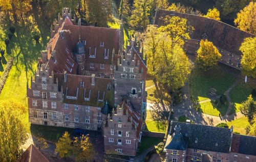 Aerial view, Heessen Castle with public school and boarding school in the autumnal forest in the