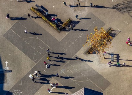 Aerial view, Overbergschule and pupils and cross on the schoolyard in the district Bockum-Hövel in