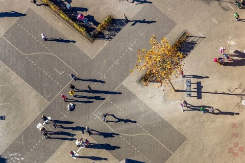 Aerial view, Overbergschule and pupils and cross on the schoolyard in the district Bockum-Hövel in
