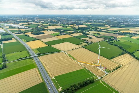 Aerial view, meadows and fields with construction site and new wind turbine, Rhynern, Hamm, Ruhr