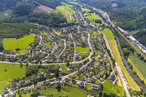 Aerial view, commercial area Bahnhofstraße at the edge of the forest on the Lenne and view of