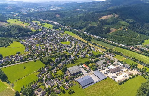 Aerial view, commercial area Bahnhofstraße at the edge of the forest on the Lenne and commercial