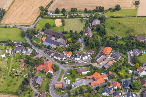 Aerial view, view of the village and evang. Village church at the cemetery in the Bausenhagen