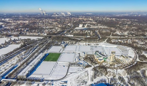 Aerial view, training ground and park stadium in the snow at the Veltins-Arena, Hotel Courtyard by