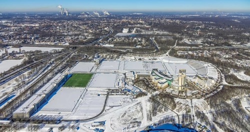 Aerial view, training ground and park stadium in the snow at the Veltins-Arena, Hotel Courtyard by