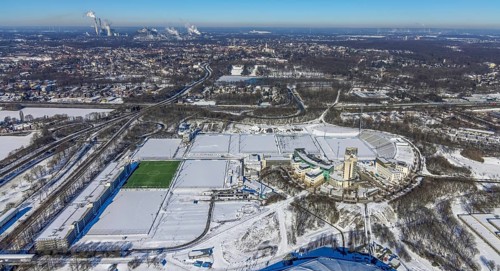 Aerial view, training ground and park stadium in the snow at the Veltins-Arena, Hotel Courtyard by
