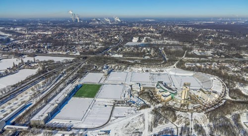 Aerial view, training ground and park stadium in the snow at the Veltins-Arena, Hotel Courtyard by