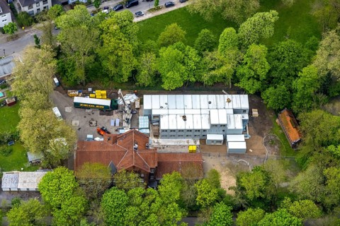 Aerial view, construction site and additional container at GGS Glückaufschule Ückendorf Außenstelle