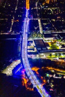 Aerial view, lighting in Schalke blue, Schalke 04, Kurt-Schumacher Straße with thyssenkrupp